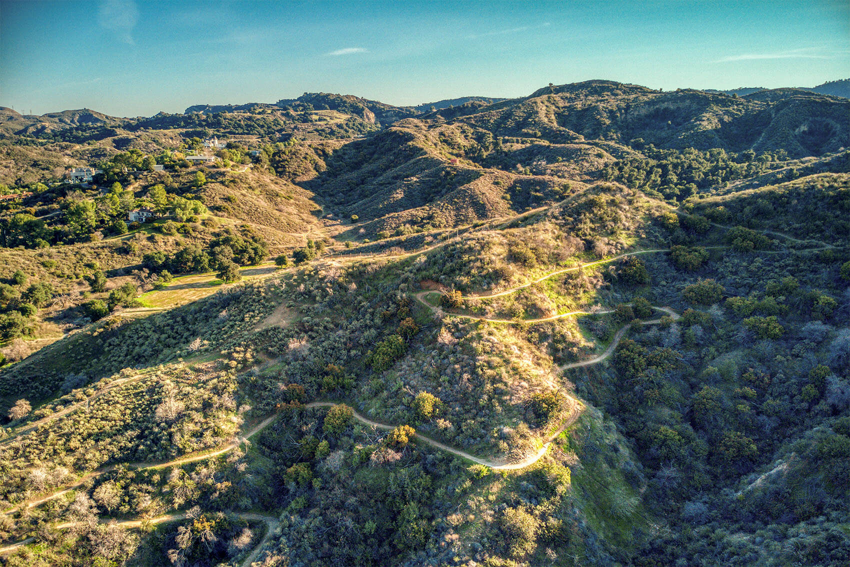 Aerial view of a residential community with pools and modern homes in the beautiful Santa Clarita Valley.