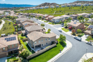 Aerial view of family-friendly Santa Clarita neighborhood with parks and mountain views, highlighting one of California’s safest cities for families.