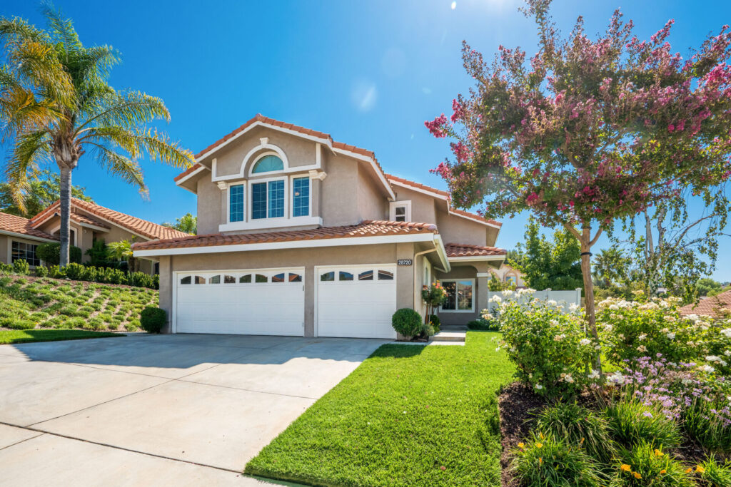 Suburban Santa Clarita home with landscaped yard, illustrating moving from Los Angeles to Santa Clarita