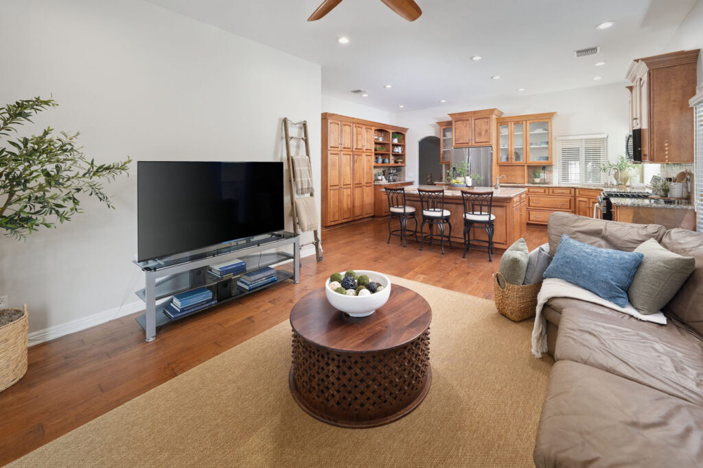 The family room of 24416 Firenze Pl overlooking the remodeled and upgraded kitchen