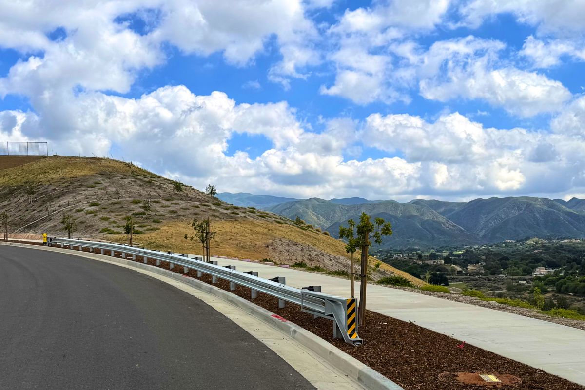 Views of the Sierra Pelona Mountains and blue cloudy skies atop the Pelona Hills neighborhood.