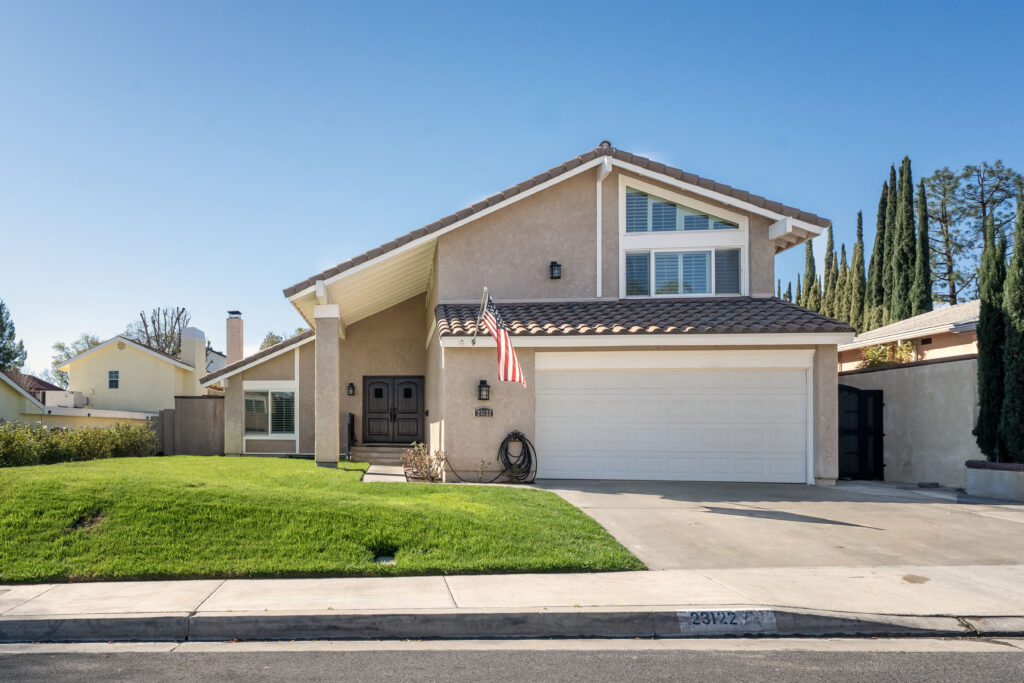An exterior photo of a typical house in the Valencia North neighborhood of Santa Clarita
