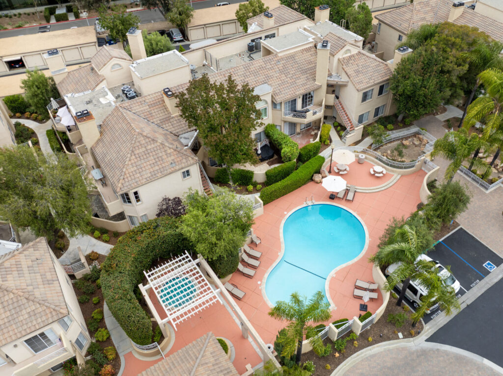 An aerial view of the community pool residents of the Santa Fe Condominiums in Valencia, California can enjoy.